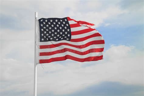 American Flag On A Blue Sky With Clouds Background Stock Photo Image