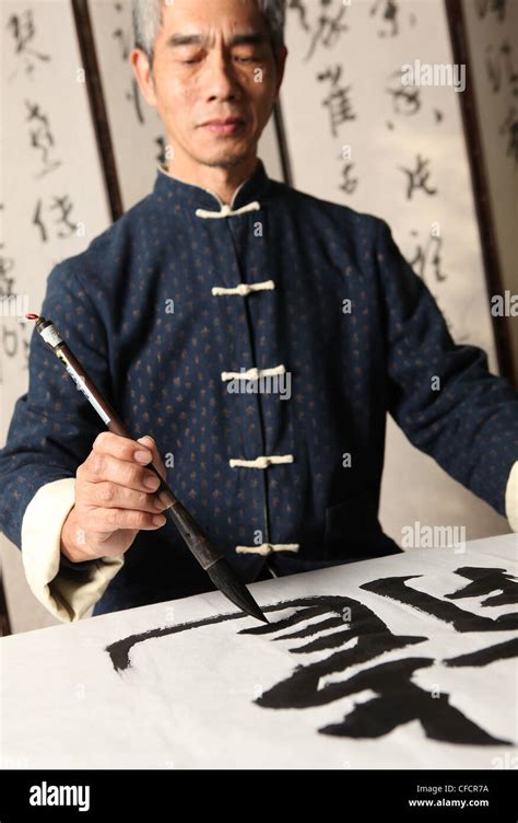 Writing chinese calligraphy, calligrapher Stock Photo - Alamy