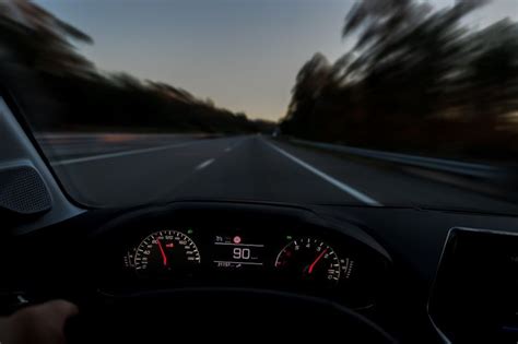 Driver View To The Speedometer At 90 Kmh Or 90 Mph And The Road Blurred