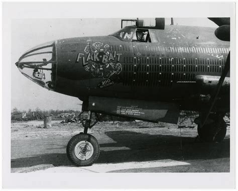 Left side view of the front section of the Martin B-26 Marauder "Flak Bait" parked on the ground ...