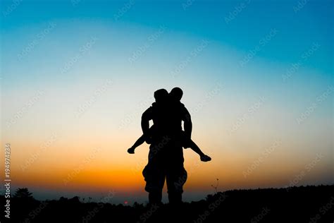 Silhouette The Son Is Riding His Father S Neck Stock Photo Adobe Stock