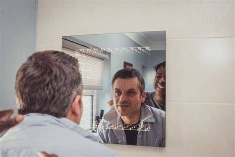 A Gay Couple Together In Front Of The Bathroom Mirror Stock Photo Image Of Greek Glance