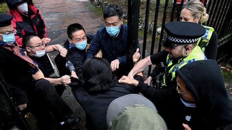 Protester dragged into Chinese consulate grounds in Manchester and ...