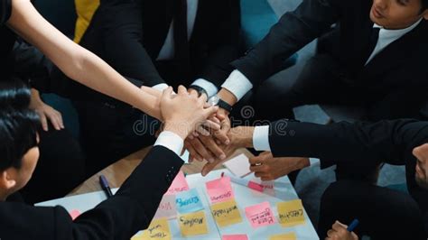 Top View Of People Putting Hands Together While Using Mind Map