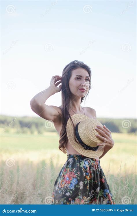 Topless Brunette Woman Covering Her Breasts With Straw Hat In The Field Stock Image Image Of