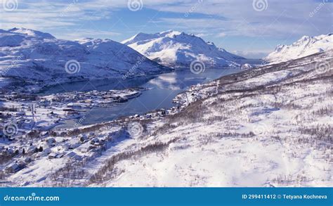 Snow Covered Mountain Range On Winter Coastline Norway Troms County