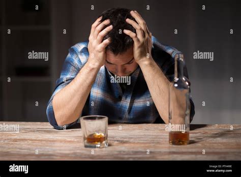 Alcoholic With Bottle Drinking Whiskey At Night Stock Photo Alamy