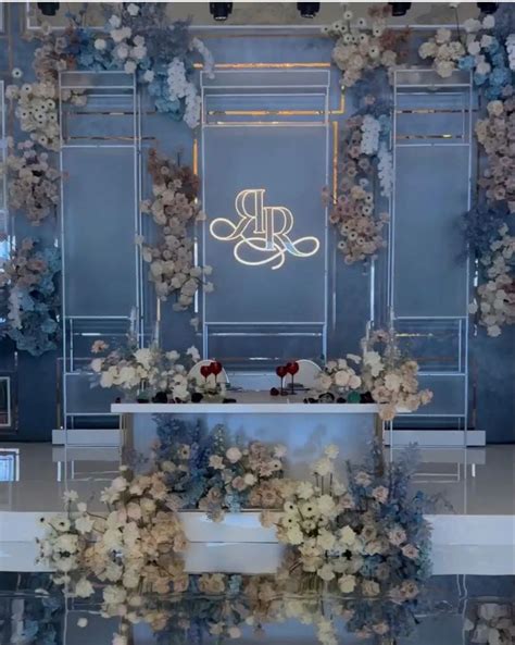 An Elegant Wedding Setup With Flowers And Candles