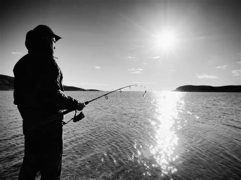 Fisherman Check Fishing Line And Pushing Bait On The Rod Fisherman