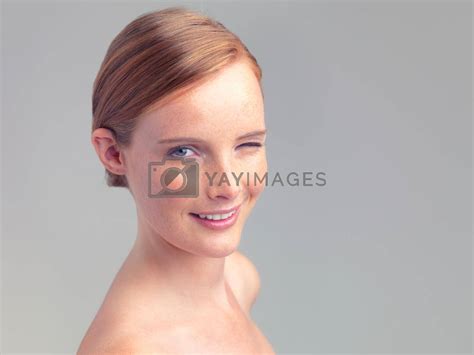 Charm And Beauty Head And Shoulders Shot Of A Beautiful Nude Woman Isolated On Grey By
