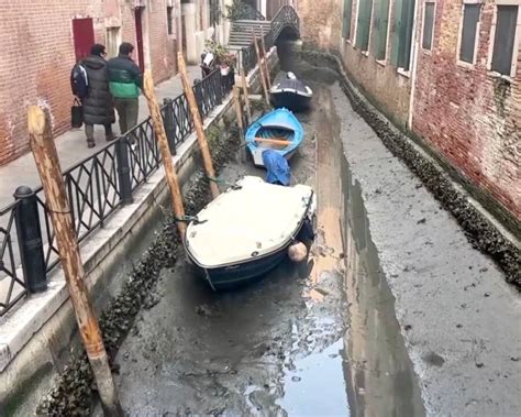 Drought And Low Tides Cause Venetian Canals To Run Dry