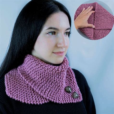 A Woman Wearing A Pink Knitted Cowl With Buttons On The Collar And Neck