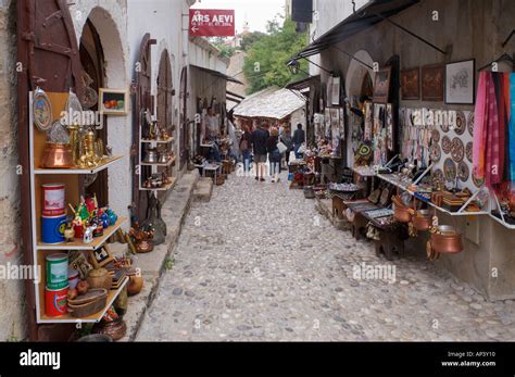 Tourist T Shops Line The Narrow Roughly Cobbled Street In Mostar