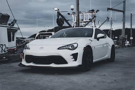 A White Toyota GT86 Parked Near the Harbor · Free Stock Photo