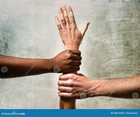 Black African American And Caucasian Hands Holding Together White Skin