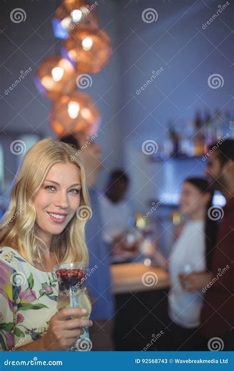 Portrait Of Smiling Woman Holding Glass Of Cocktail Stock Image Image