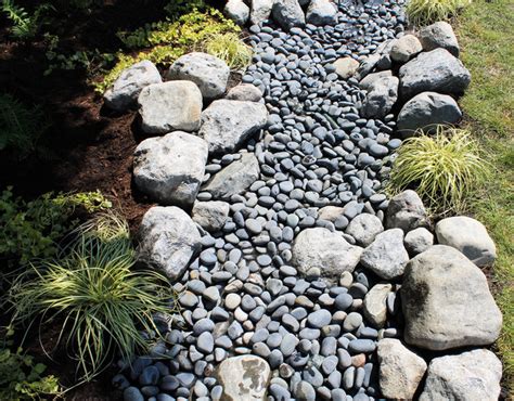 Water And Stone Dry Riverbed Garden Traditional Landscape