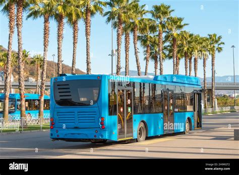 blue city bus   route stop waiting  passengers stock photo alamy
