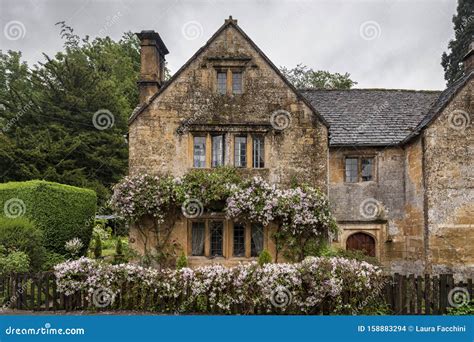 Beautiful And Typical Cotswold Stone House In The Cotswold Village Of