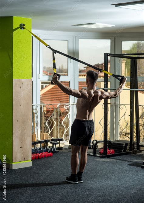 Man With Nude Torso And Muscular Back In Gym Enjoy Training Trx Man With Torso Sportsman