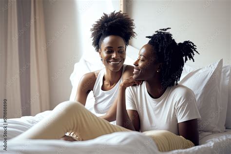 Generative AI Illustration Of A Black Lesbian Couple Inside The Bed Of Their Room Looking At