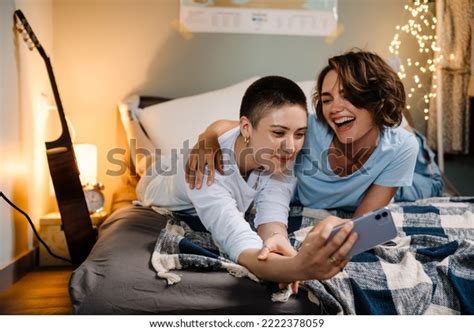 Two Lesbian Girls Smiling Taking Selfie Stock Photo