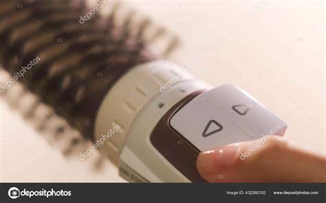 Close Up Of Hot Air Rotating Hair Styler In Female Hands Concept Woman Hands Showing The Work