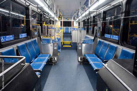 Interior of lighted city bus at night transit Stock Photo | Adobe Stock