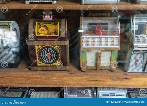 Mini Vintage Retro Jukebox Music Machine in Wooden Shelf Display Editorial Stock Image - Image ...