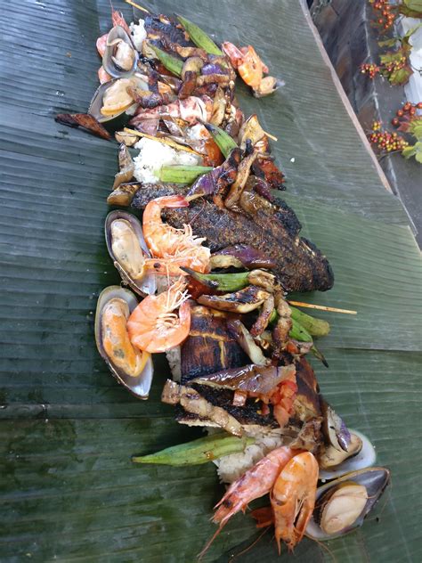 [I ate]Kamayan a Filipino seafood dinner served on banana leaves and eaten using your hands ...