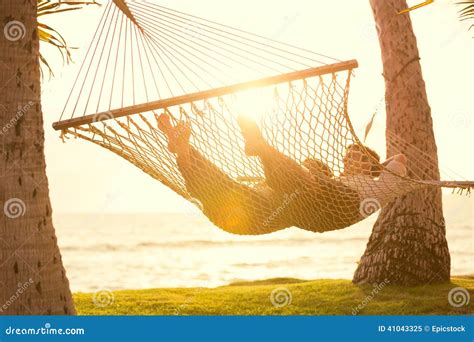 Couple Relaxing In Tropical Hammock Stock Image Image Of Relaxation