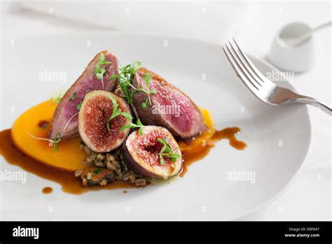 Duck And Fig Entree In High End Resturant Stock Photo Royalty Free