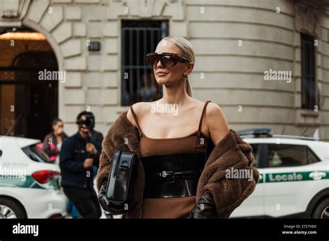 Leonie Hanne Wears Brown Dress Black Corset Gloves Teddy Coat Seen