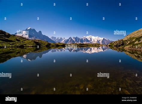 The Peaks Of The Mont Blanc Massif Are Reflecting On The Surface Of