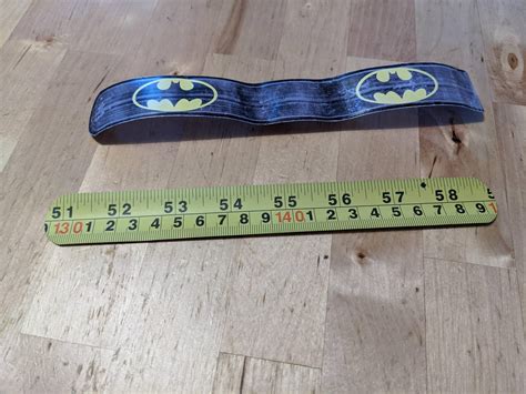 The inside of my son's slap bracelet is part of a tape measure. : r