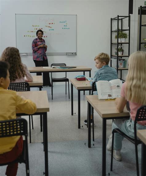 Teacher Standing in front of a Whiteboard · Free Stock Photo