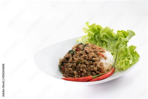Thai Food Stir Fried Hot And Spicy Pork With Holy Basil Served With White Rice On White