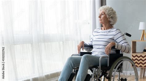 Pensive Sick Disabled Old Lady Sit In Wheelchair Look In Distance Feel