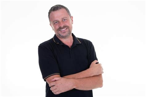 Premium Photo Portrait Of Caucasian Mature Middleaged Man In Black Shirt Looking At Camera And