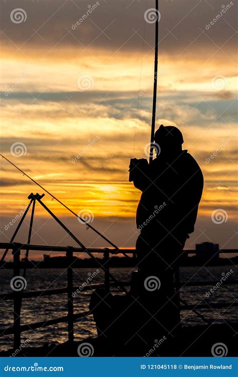 Sea Fisherman At Sunset Silhouette Stock Photo Image Of Dusk