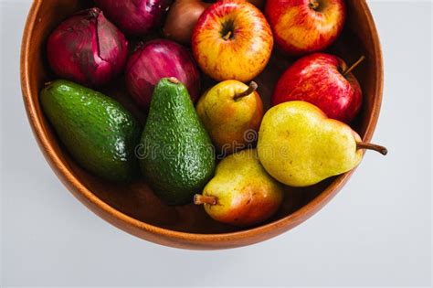 Wooden Fruit Bowl With Apples Pears Onions And Avocadoes Healthy