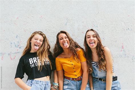 Three Teen Girls Showing Their Tongue To Camera By Stocksy Contributor Victor Torres Stocksy