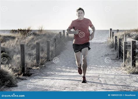 Young Attractive And Happy Sport Runner Man With Fit And Strong Healthy