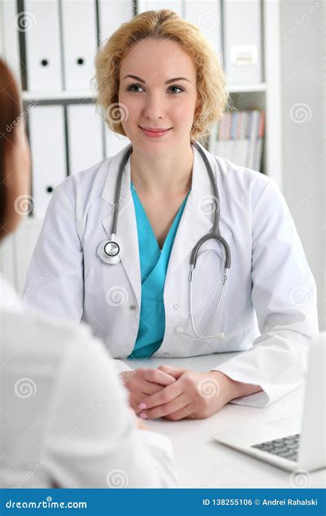 Happy Blonde Female Doctor And Patient Discussing Medical Examination Results Medicine