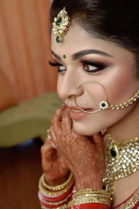 Photo Of A Bride In A Silver Lehenga Wearing Light Nude Makeup