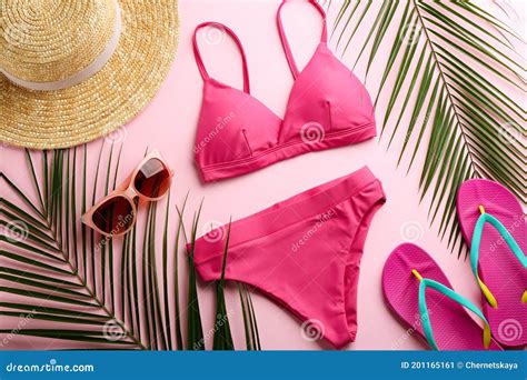 Beautiful Bikini And Beach Accessories On Pink Background Flat Lay Stock Image Image Of Leaf