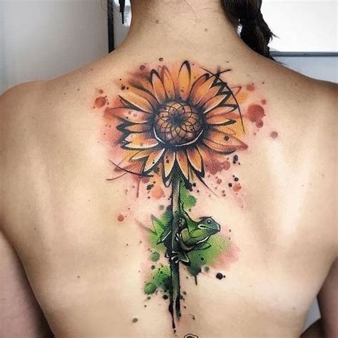 A Woman With A Sunflower Tattoo On Her Back