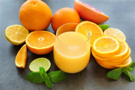 Premium Photo Glass Of Fresh Orange Juice On Table