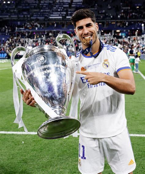 Marco Asensio Player Of Real Madrid Posing With The Trophy During The