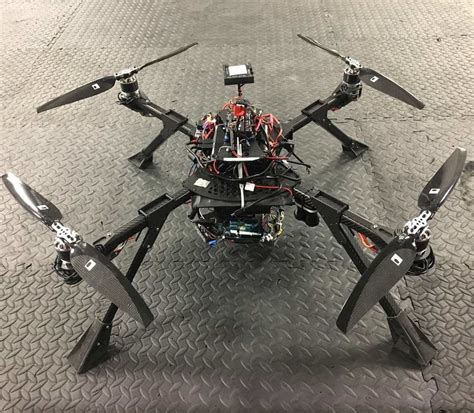 14 The Quadrotor Fully Equipped With The Gripper And Other Components